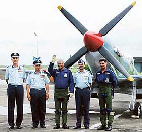 The Union Defence Minister, Mr George Fernandes, waves at Ambala air base next to Spitfire aircraft