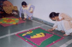 Participants in the rangoli competition show their skills at the Panjab University Zonal Festival, which began at BCM College of Education