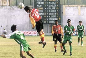 Players of East Bengal and Salgaocar vie for the ball during the final of Durand Football Tournament at the Ambedkar Stadium in the Capital
