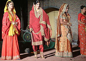Models present costumes designed by students of the Department of Design of BBK DAV College, Amritsar