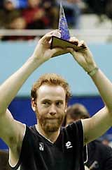 Switzerland's Marc Rosset raises the trophy after winning the Tatra Banka Open ATP Tour tournament in Bratislava, Slovakia