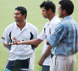 Sachin Tendulkar, Rahul Dravid and Javgal Srinath discuss during a practice session in Bangalore