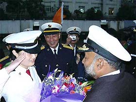 Flag Officer Commanding of the Eastern Fleet of the Indian Navy, Rear-Admiral R.P. Suthan, being welcomed by Xu Jiwei, commander of the Shanghai base of the Chinese People's Liberation Army navy