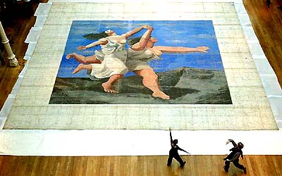 Two dancers rehearse in front of the stage curtain measuring 10.3m x 11.7m, world�s largest signed Picasso canvas