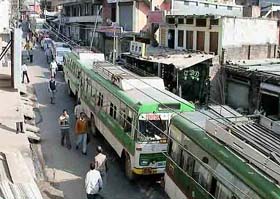 Buses and other vehicles line up on the Hamirpur- Sujanpur Tira road due to a blockade