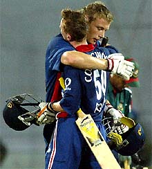 England batsmen Andrew Flintoff and Paul Collingwood hug each other after their victory over Bangladesh in the third one-day international match in Dhaka
