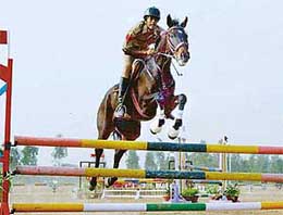 Navjot Singh of Delhi Police clears a hurdle during the ongoing equestrian events
