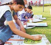 Girls take part in a painting competition 