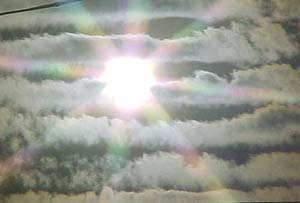 Thin clouds cover the blazing sun