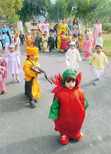 Children in fancy dresses hold a procession in connection with Children�s Day in front of the Nursery and Daycare Centre, PAU, Ludhiana