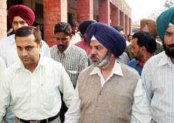 The PTU Director, Mr Sadhu Singh, being taken to a Jalandhar court on Thursday.
