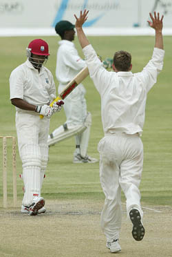 Zimbabwean bowler Andy Blignaut celebrates the dismissal of West Indies skipper Brian Lara