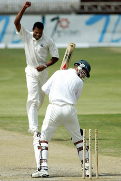 Mervyn Dillon celebrates the dismissal of Zimbabwean batsman Trevor Gripper 