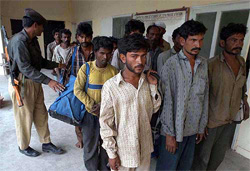 Indian fishermen being produced at a police station in Karachi 