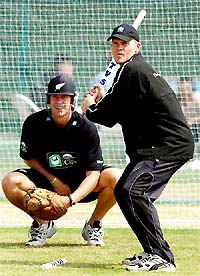 New Zealand's Lou Vincent plays baseball with a stump along with team-mate Jacob Oram in Hyderabad 