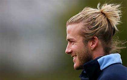 England soccer captain David Beckham smiles at a training session in Manchester