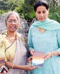 Sushma Sagar (left) and MP Preneet Kaur on the occasion of the release of the former�s collection of poems