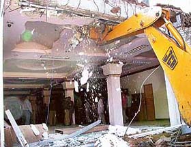 Illegal construction along Madhya Marg, Sector 7, being demolished