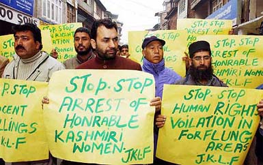 JKLF activists led by group vice-president Javid Ahmad Mir (centre) stage a march