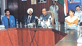 Minister of State for Youth Affairs and Sports Vijay Goel, flanked by Gurbachan Singh Randhawa and Madhumita Bisht, addressing a gathering to celebrate the allotment of the Commonwealth Games to India at the National Stadium on Saturday