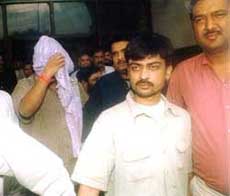 Accused in the Madhumita Shukla murder case, Rohit Chaturvedi (face covered), and Prakash Chandra Pandey