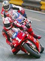 Britain's Michael Rutter (front) rides his Ducati 998, followed closely by compatriot John McGuinness