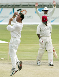 Heath Streak celebrates after bowling out West Indies captain Brian Lara