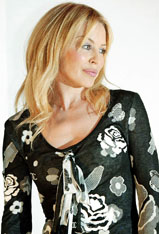 Australian singer Kylie Minogue poses at a news conference to launch her 'Money Can't Buy' show