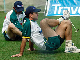 Australian captain Ricky Pointing stretches with his teammate Damien Martyn