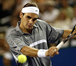 Roger Federer of Switzerland returns a volley