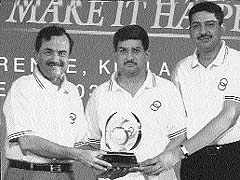 Mr Deepak Joshi (centre), Managing Director, Joshi Autozone, and Mr Vikram Joshi (R) receive the Maruti �Award for Excellence in Sales and Service� at a dealers� convention in Malaysia.