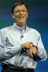Bill Gates points to his Fossil SPOT watch during a keynote address for the Comdex computer convention in Las Vegas 