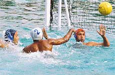 The teams of Kerala University and Pune University vie for top honours in the water polo event 