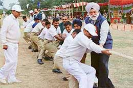 The Deputy Speaker, Punjab, Mr Bir Devinder Singh, joins ITBP men in a tug-of-war after inaugurating the force�s