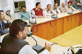 Members of political parties listen to the Mayor, Mr Subhash Chawla, during an all-party meeting on the stray cattle menace, held at the Municipal Corporation office, Sector 17, Chandigarh, on Tuesday.
