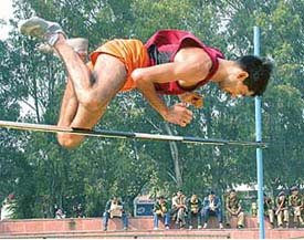 A trooper clears the bar during the high jump competition on the second day of the Indo-Tibetan Border Police Force�s 23rd inter-sector athletics meet in Chandigarh on Tuesday.