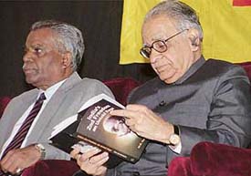 Mr T.N. Chaturvedi, Governor of Karnataka, goes through the pages of �India�s Second Freedom: An Untold Saga� by M.G. Devasahayan at Panjab University on Tuesday.