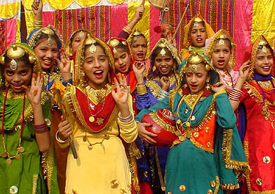 Elementary schoolchildren perform gidha at an inter-school contest