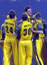 Australia's Nathan Bracken being congratulated by teammates after he dismissed Virender Sehwag