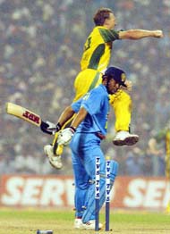 Australian bowler Andy Bichel jumps into the air after dismissing Sachin Tendulkar