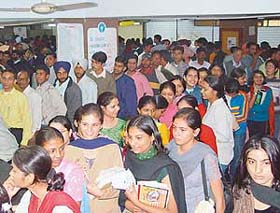 Heavy rush of students at the forms and fee counter for private candidates at the Administrative Block of Panjab University