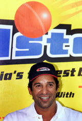 Former Pakistan cricket captain Wasim Akram smiles during a Press conference in Mumbai 