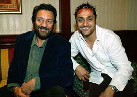Filmmaker Shekhar Kapur and Bollywood actor Rahul Bose strike a pose during a seminar in Mumbai 