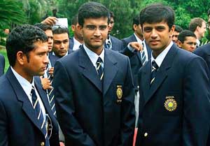 Indian cricket captain Sourav Ganguly stands with teammates Rahul Dravid and Sachin Tendulkar before leaving for Australia
