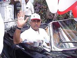 India's first cosmonaut, retired Wing Commander Rakesh Sharma, drives a 1961 Jaguar-E type car at ITC Windsor Sheraton Vintage and classic car rally in Bangalore