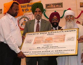 Mr Vijay Goyal, president, Sahara Jan Sewa, receives the fourth Bhai Kanhaiya Award from Dr S.S. Johal, Vice-Chairman, Punjab Planning Board, at Bathinda on Sunday