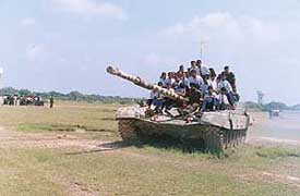 Students take a ride on an infantry combat vehicle during a motivational campaign at Patiala.