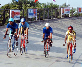 Cyclists in action during the 100m massed start