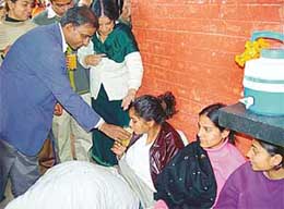 The DPI (Colleges), Mr Dilip Kumar, offers juice to striking students after announcing that the UT Administration had agreed to their demands