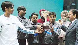 The winners of the Accountant-General, Uttar Pradesh, with the men team championship trophy